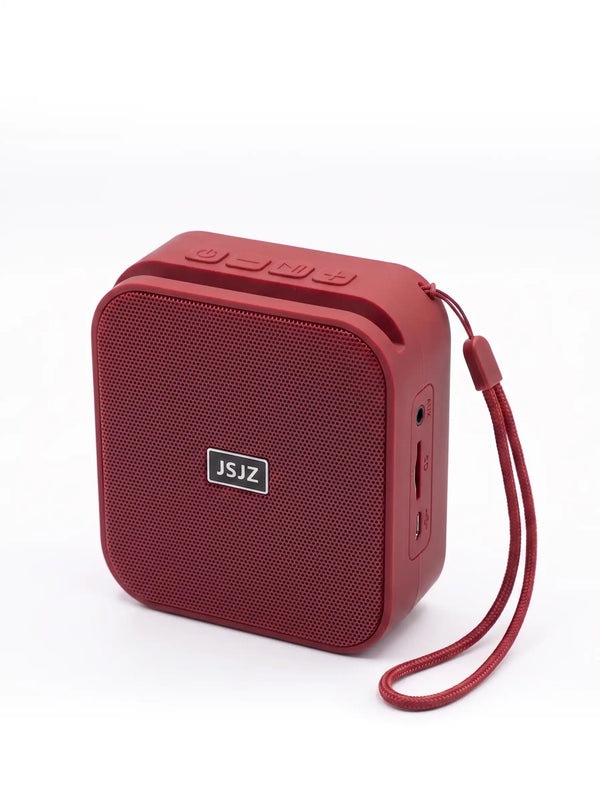 Red portable speaker with a strap on a white background