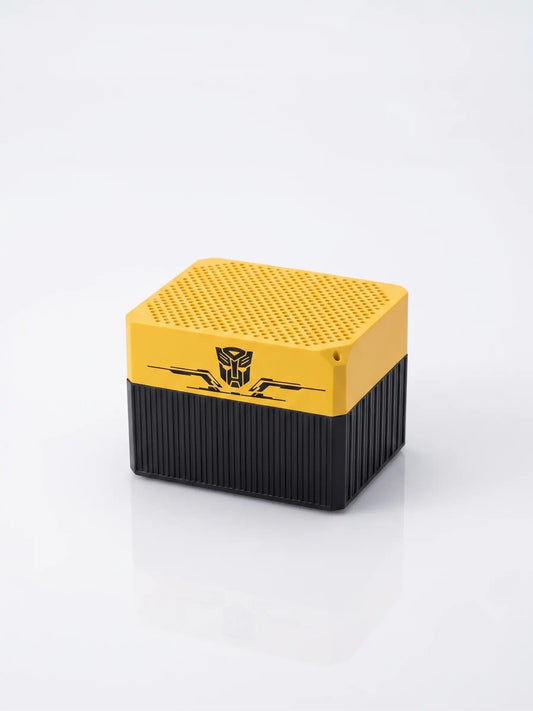 Yellow and black speaker with transformers logo on a white background